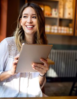 beautiful-brunette-girl-using-tablet-for-work-9Q25GCL.jpg