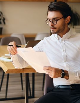 young-serious-businessman-in-eyeglasses-WU7QCKG.jpg